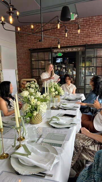 Table setting with white and green centerpieces at The Poynt, Newburyport